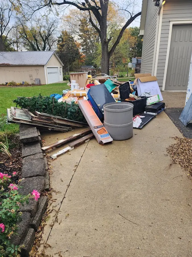 Dumpster being loaded with debris for 12 Yard Dumpster Rental in Cheraw